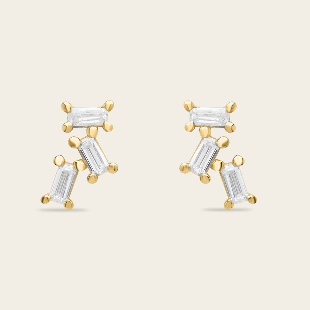 Clous d'oreilles triple baguette or et diamants dularee